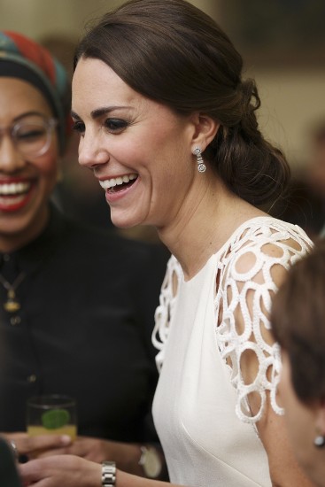 Catherine, the Duchess of Cambridge (R) speaks with guests at a reception hosted by the Governor General Peter Cosgrove and his wife during a reception hosted by the Cosgrove and his wife at Government House in Canberra on April 24, 2014. Britain's Prince William, his wife Kate and their son Prince George are on a three-week tour of New Zealand and Australia. AFP PHOTO / POOL